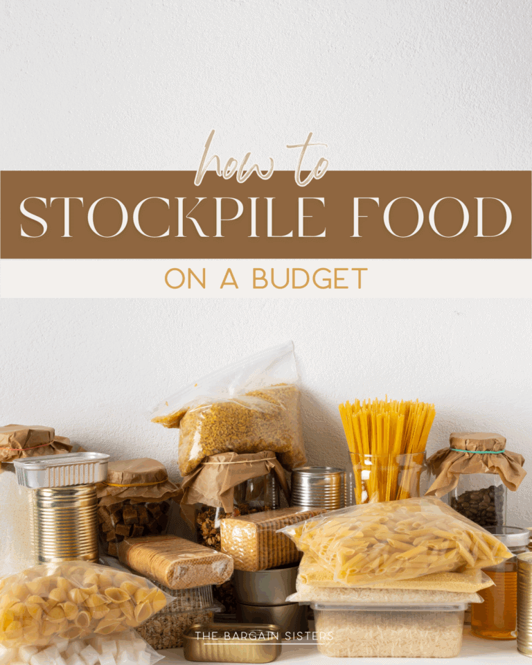 Assorted dry foods like pasta, rice, lentils, and canned goods are neatly arranged on a white surface. Text above reads, "How to stockpile food on a budget," offering simple tips for building your pantry without overspending.