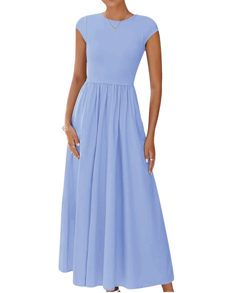 Woman wearing a light blue, cap-sleeve, floor-length dress with a fitted bodice and gathered skirt. She accessorizes with bracelets, rings, and a necklace. The background is white.