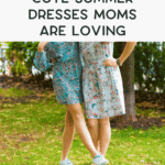 Two women in patterned summer dresses stand side by side on grass in a park, smiling with trees and outdoor planters in the background. Text at the top reads, "Cute summer dresses moms are loving.