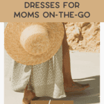 A woman in a flowy summer dress holds a straw hat by her side while standing barefoot among outdoor planters. Text reads: "Easy Summer Dresses for Moms On-the-Go." Website: thebargainsisters.com.