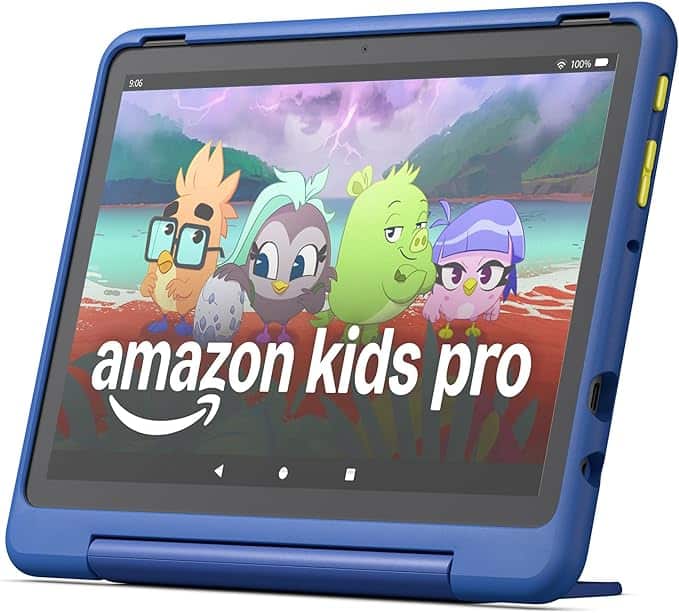 A blue tablet with a cartoon display featuring four colorful animal characters and "amazon kids pro" on the screen. The device has yellow buttons on the side, a protective blue case, and is now available with exclusive Friday Deals.