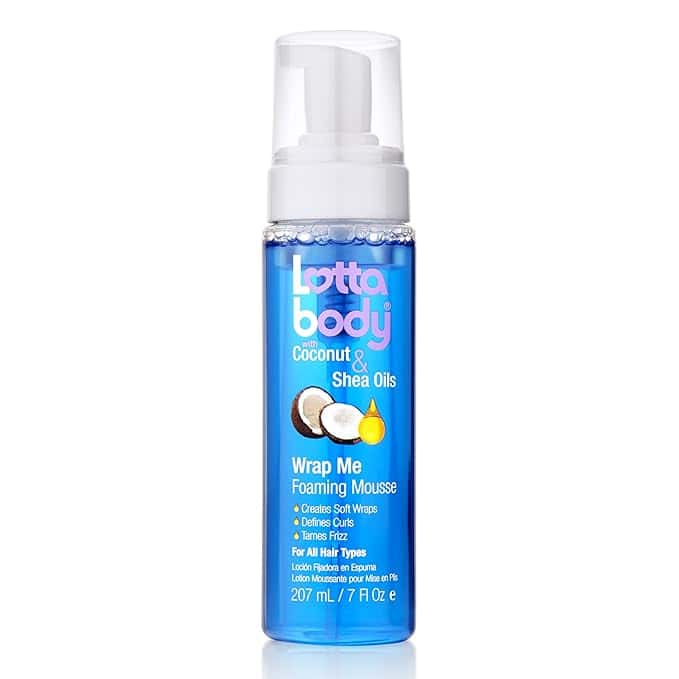A bottle of Lottabody Wrap Me Foaming Mousse with coconut and shea oils, featuring a white pump top and blue body. Snag Thursday Deals on this mousse that defines curls, tames frizz, and gives you soft wraps.