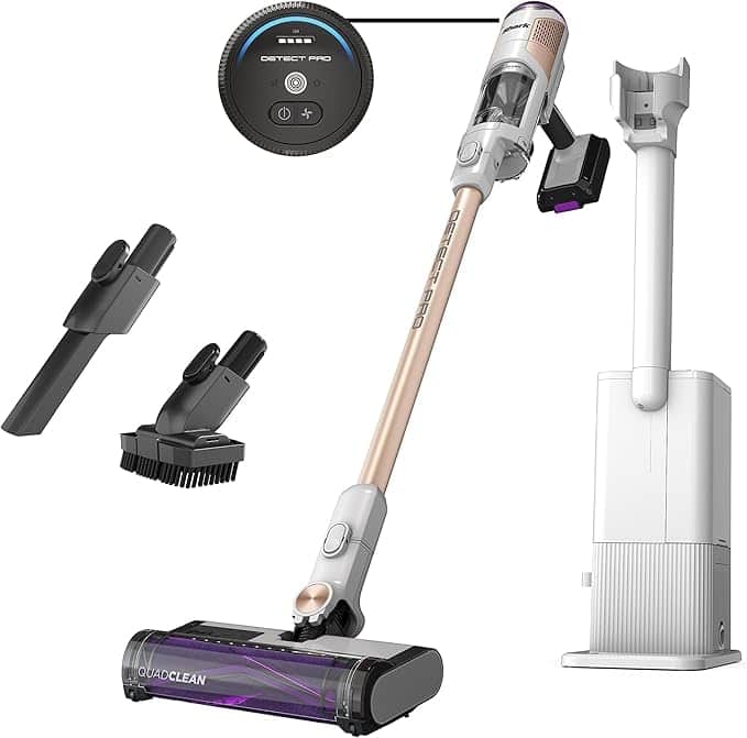 Cordless stick vacuum cleaner with attachments, including a crevice tool, brush tool, and charging dock. Features a circular close-up of the “Detect Pro” control panel. Shown standing upright—don’t miss unbeatable Monday Deals on this powerful cleaner!.
