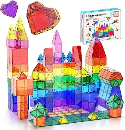 Colorful magnetic building tiles arranged into castle and tower shapes, with two heart shapes floating above and a PicassoTiles toy box in the background displaying the set—perfect for Tuesday Deals shoppers.