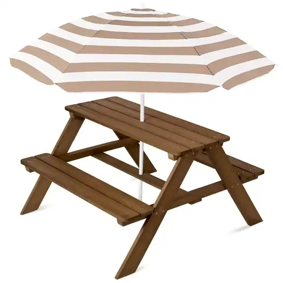 A wooden picnic table with attached benches and a large beige and white striped umbrella providing shade in the center—perfect for enjoying your Monday Deals outdoors.