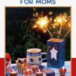 A patriotic table setting features red, white, and blue star-themed mugs, bowls, and candles, with a blue lantern holding sparklers, perfect for a festive celebration. Text reads: "Red White and Blue Decor Ideas for Moms.