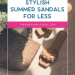 A pair of tan woven sandals lies on a wooden floor beside a woven bag and white flowers. Text overlay reads: "Stylish Summer Sandals for Less. thebargainsisters.com.