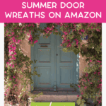 A teal blue door surrounded by vibrant pink and green floral wreaths, with text overlay: "Our Favorite Summer Door Wreaths on Amazon. Read more. thebargainsisters.com".