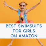 Young girl wearing sunglasses and a flamingo floatie, jumping joyfully against an orange background. Text overlay reads: "Best Swimsuits for Girls on Amazon.