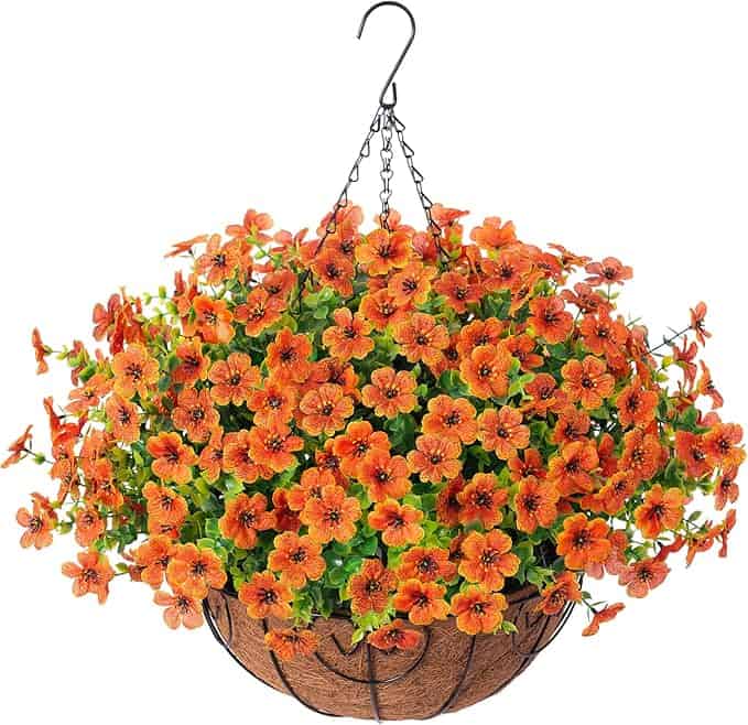 A hanging basket filled with vibrant orange flowers and green leaves, supported by a black metal chain and hook, against a white background—perfect for brightening up your space and ideal for Tuesday Deals.