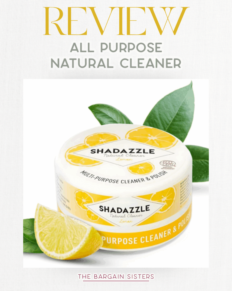 A container of Shadazzle all-purpose cleaner is shown with a lemon slice and green leaves beside it. The product label features yellow lemons and text promoting this natural cleaner and polish.