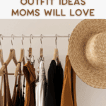 A clothing rack with neutral-toned outfits on wooden hangers and a wide-brimmed straw hat. Text above reads, "Amazon Outfit Ideas Moms Will Love." Website: thebargainsisters.com.