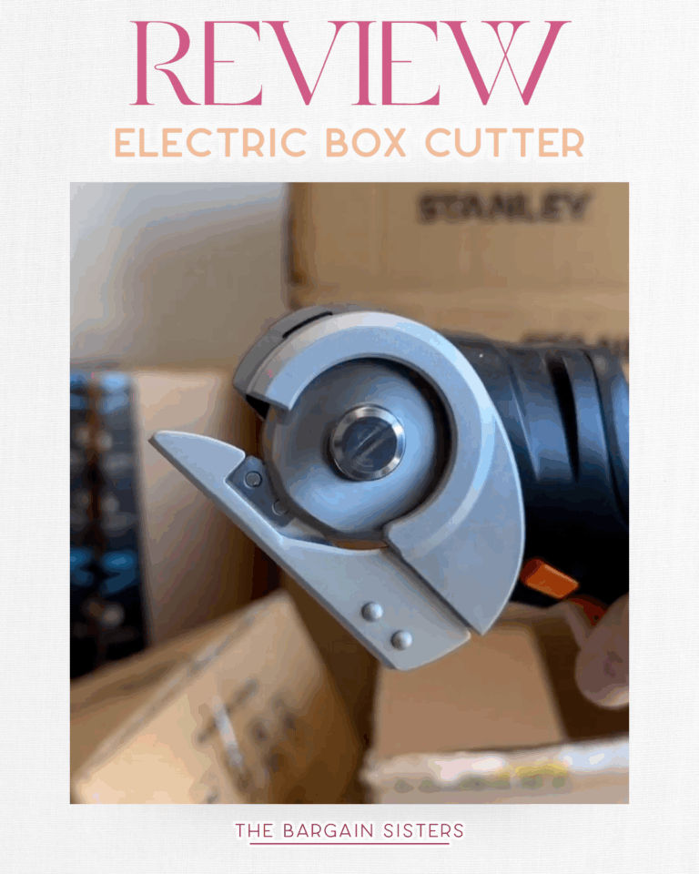 A close-up of an electric box cutter held in front of cardboard boxes, with the text "Review Electric Box Cutter" and "The Bargain Sisters" above and below the image—a must-have tool like your favorite wall cleaning solution.