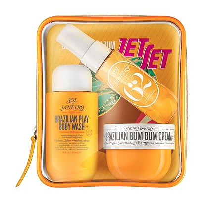 Sol de Janeiro Jet Set gift set in a clear zippered pouch, featuring Brazilian Play Body Wash, a spray bottle, and a jar of Bum Bum Cream—all in vibrant packaging for a premium beauty experience.