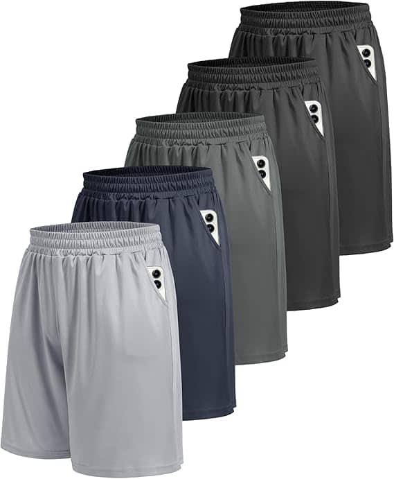 Five pairs of athletic shorts in different colors—light gray, navy blue, greenish-gray, dark gray, and black—are arranged in a staggered row with elastic waistbands and white pocket accents. Perfect for Monday Deals shopping.
