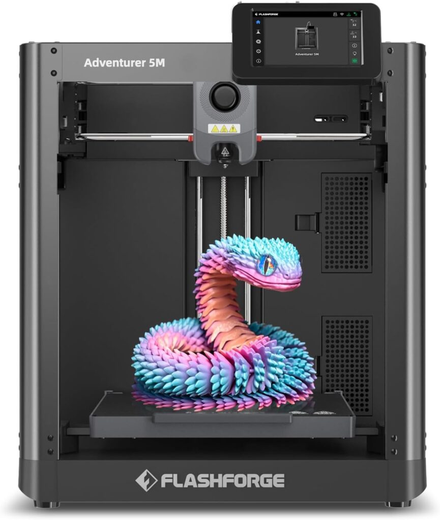 A Flashforge Adventurer 5M 3D printer is printing a colorful, coiled snake model in blue, purple, and pink hues. The touchscreen display on the upper right corner adds convenience—perfect for those looking to upgrade with Monday Deals.