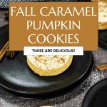 A plate of fall caramel pumpkin cookies sits on a dark table with autumn decorations, including a small bouquet and cinnamon sticks. The text overlay reads, "Fall Caramel Pumpkin Cookies. These are delicious!.