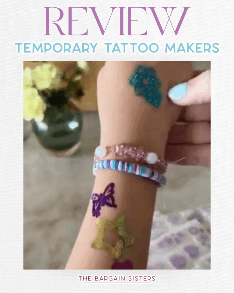 A hand decorated with colorful glitter temporary tattoos and bracelets is shown. The text above reads "Review Temporary Tattoo Makers," and below it says, "The Bargain Sisters." An air conditioner cover and a vase of yellow flowers are in the background.