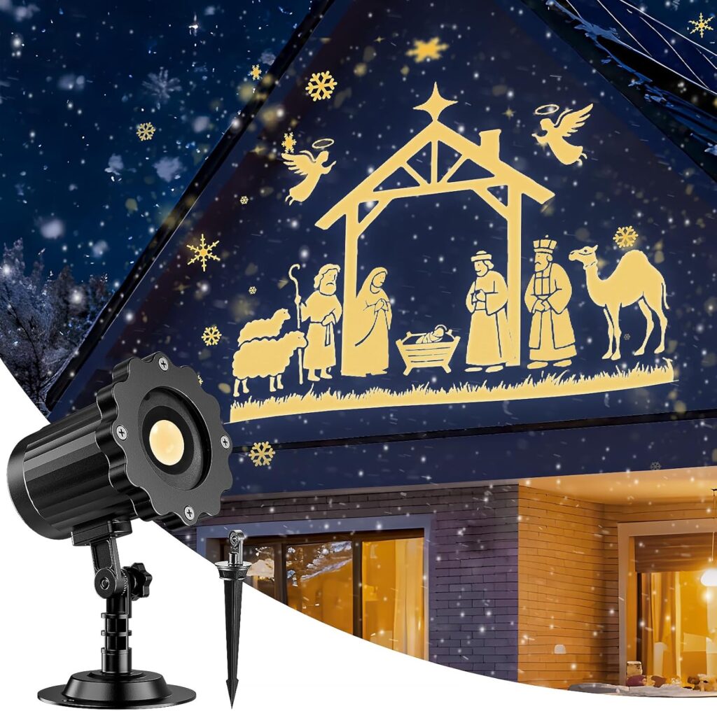 A nativity scene with angels, shepherds, and animals is projected in yellow light onto a house at night by an outdoor projector, with snowflakes in the air—perfect for a festive touch during Monday Deals.