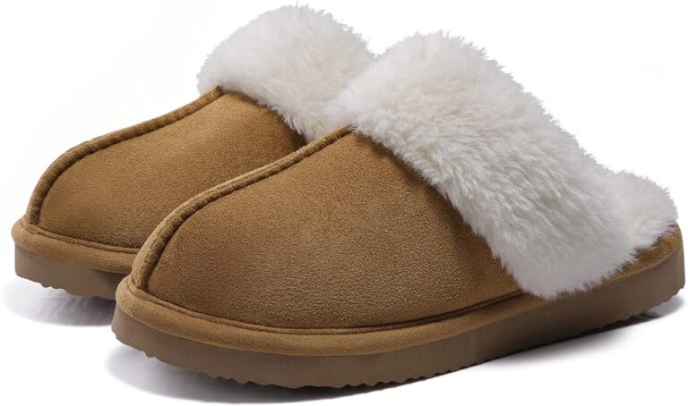 A pair of cozy, brown suede slippers with thick, white, fluffy lining around the opening is shown on a white background—perfect for relaxing at home and a great find in our Monday Deals.
