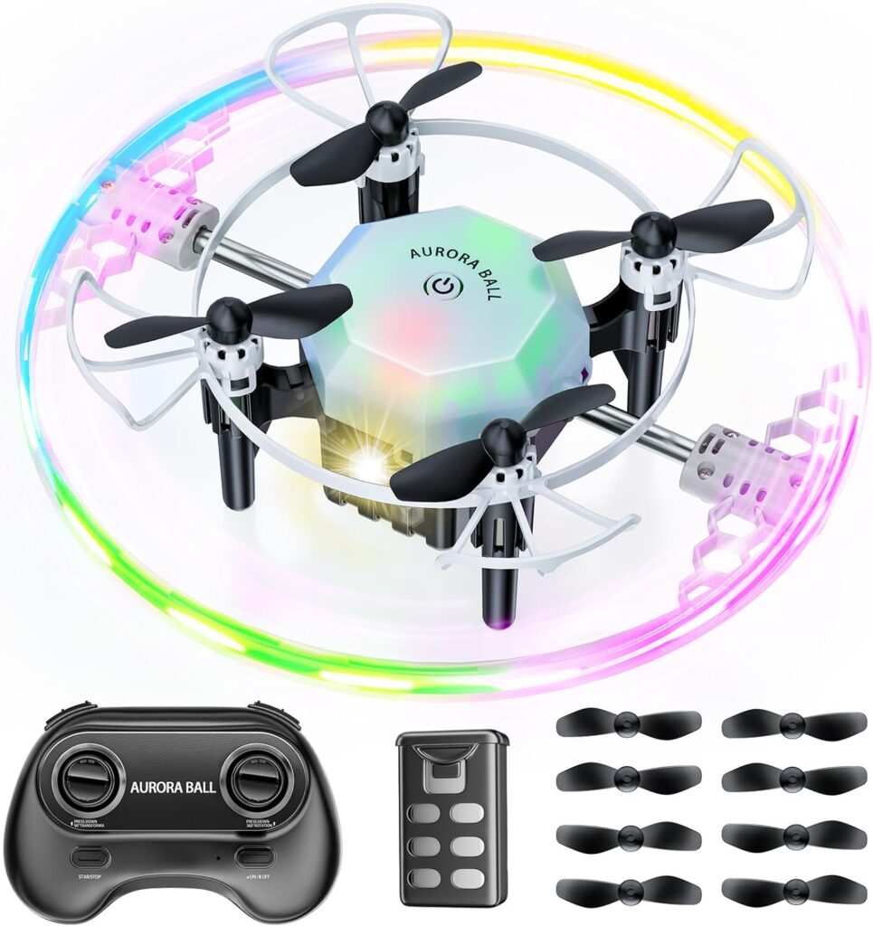 A small quadcopter drone with a glowing, multicolored LED ring around its frame, shown with a remote control, spare propellers, and a rechargeable battery. The Aurora Ball is perfect for Thursday Deals shoppers seeking fun tech.