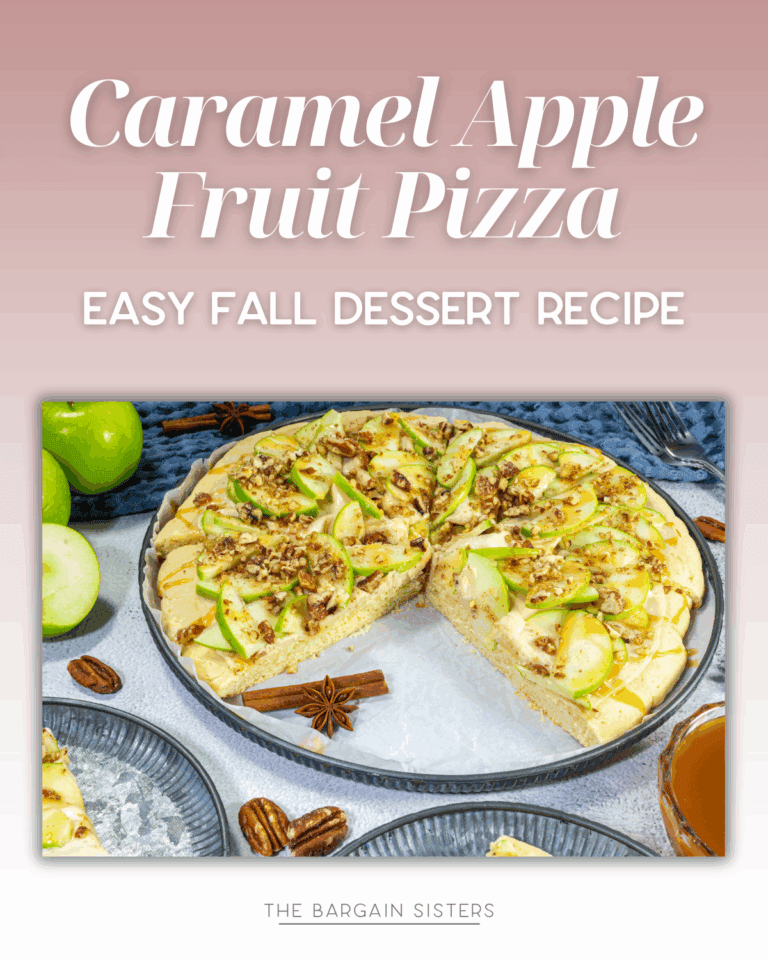 A caramel apple fruit pizza topped with crisp apple slices, pecans, and caramel sauce sits on a plate with a slice missing. Surrounded by green apples, pecans, and cinnamon sticks, it’s the perfect fall treat. Text reads "Caramel Apple Fruit Pizza.