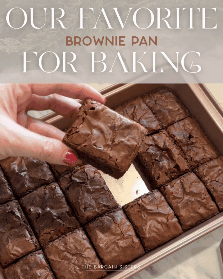 A hand with red nail polish lifts a brownie from a pan filled with neatly cut brownies, ready to cool on a 3 tier cooling rack. Text at the top reads, "Our Favorite Brownie Pan for Baking.