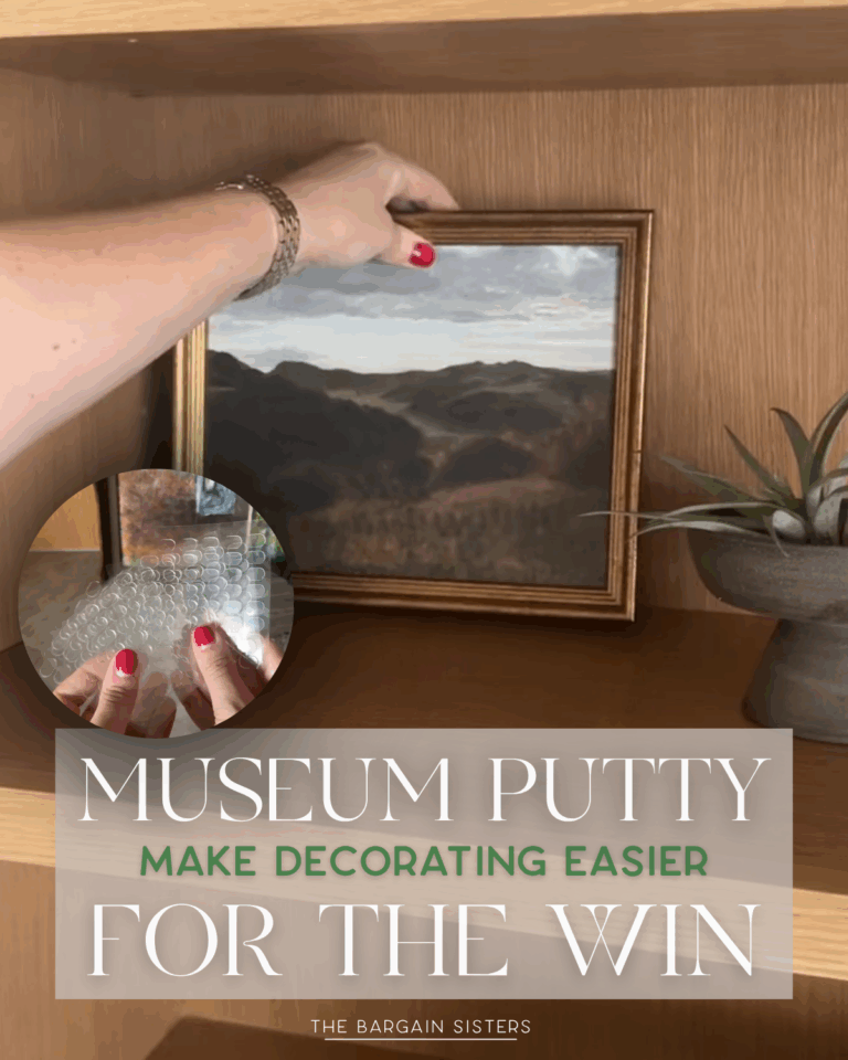 A hand secures a framed landscape painting on a wooden shelf with Museum Putty. An inset shows clear putty dots. Text: "Museum Putty makes decor easier. For the win. The Bargain Sisters.