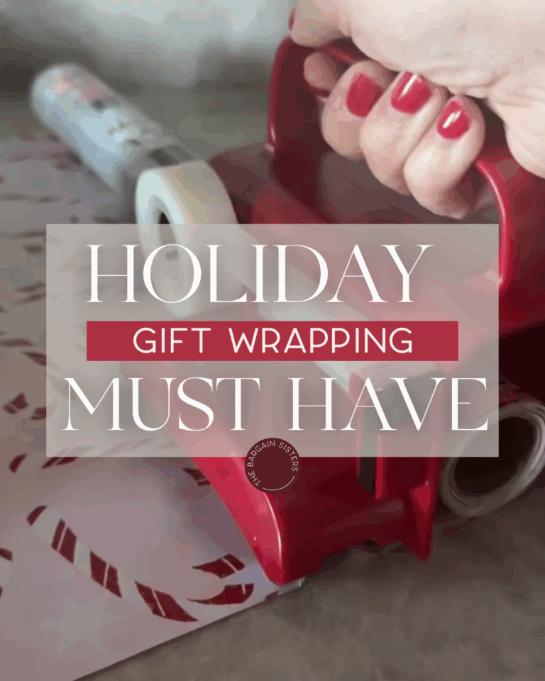 A hand with red nail polish holds a red tape dispenser and a wrapping paper cutter, preparing to wrap a gift. The background shows festive wrapping paper, and overlay text reads: "Holiday Gift Wrapping Must Have.
