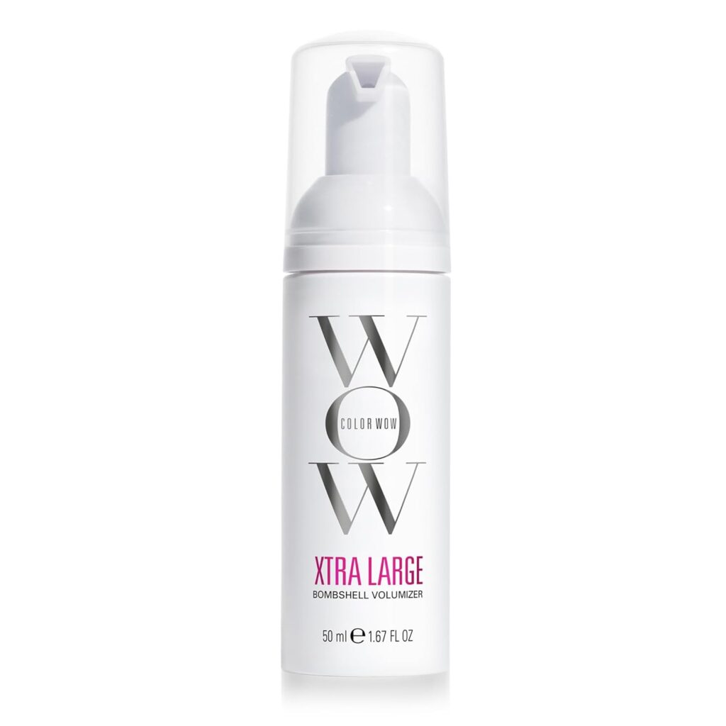 A white bottle of Color Wow Xtra Large Bombshell Volumizer, 50 ml (1.7 fl oz), with a clear cap and bold black and pink text on the label.