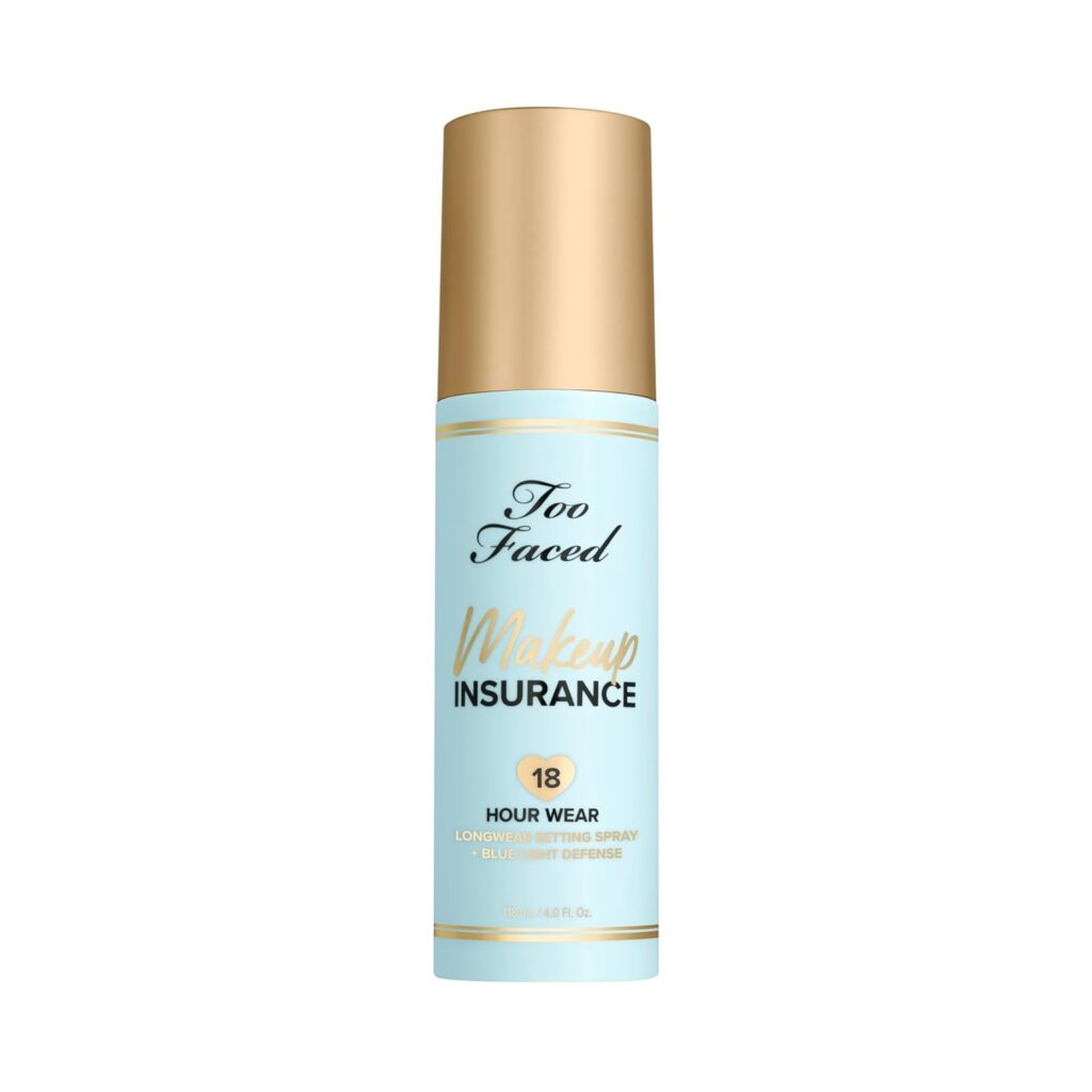 A light blue and gold bottle of Too Faced Makeup Insurance 18 Hour Wear Longwear Setting Spray is shown against a white background.