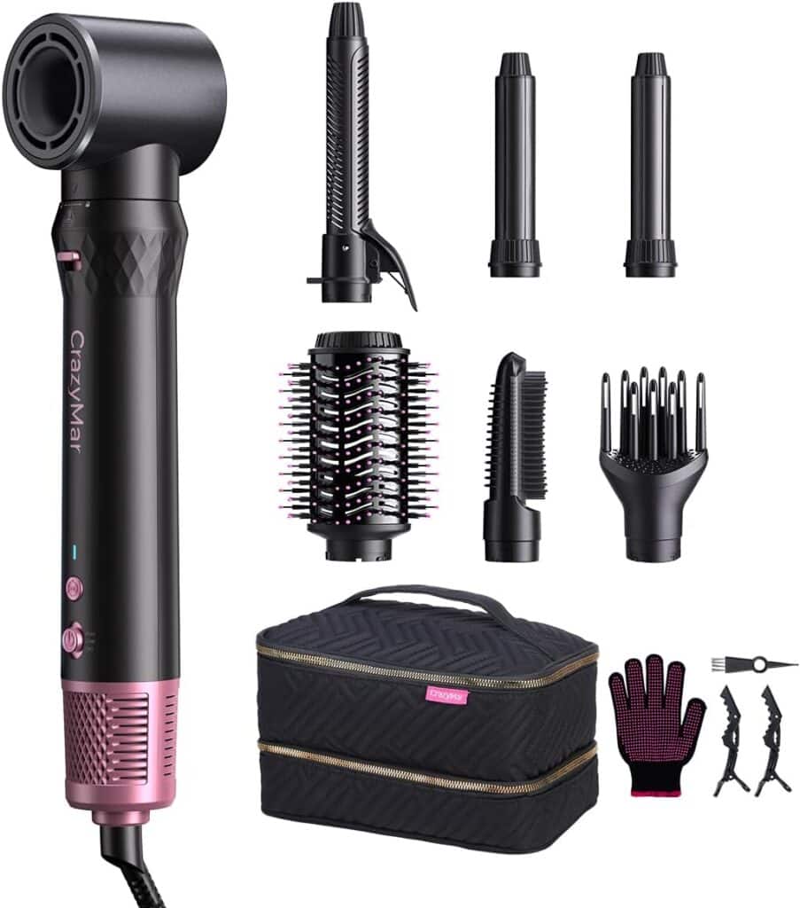 A hair styling set featuring a pink and black hair dryer with "CrazyMar" branding, six interchangeable attachments, a black storage case, a heat-resistant glove, hair clips, and a comb.