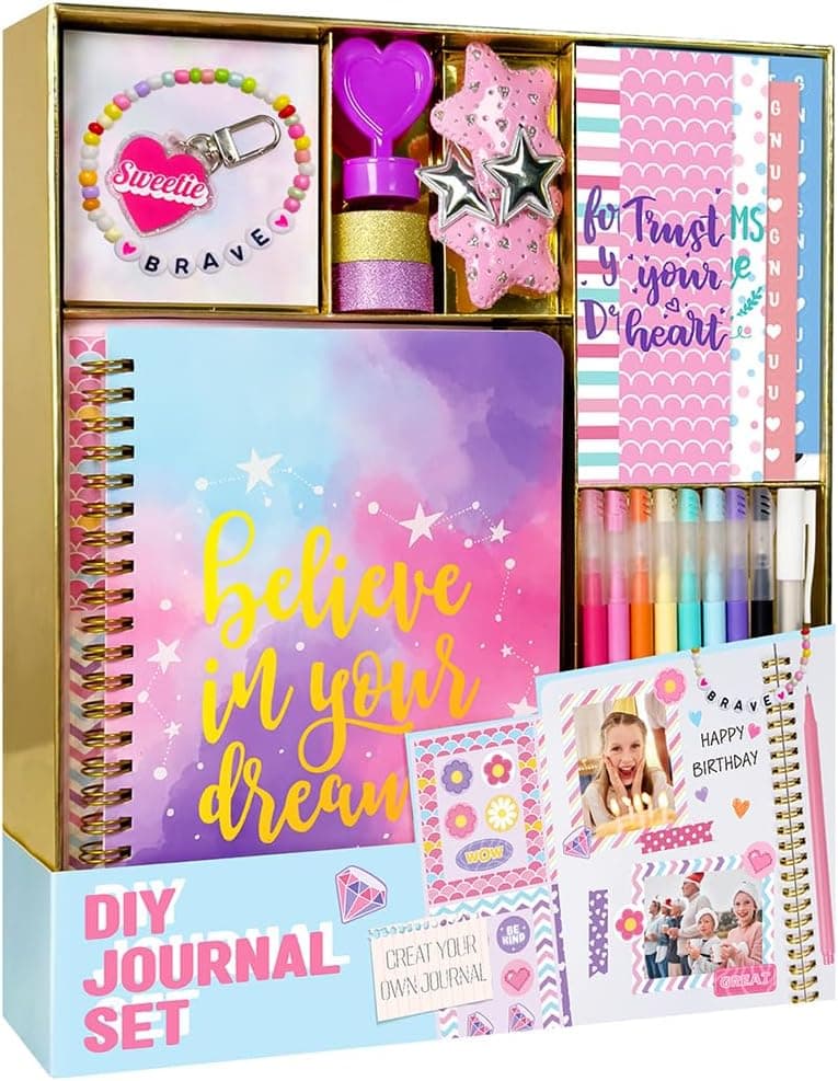 A colorful DIY journal set including a spiral-bound journal with “Believe in your dreams” on the cover, markers, stickers, a beaded bracelet, glitter glue, heart-shaped stamps, and decorative accessories.