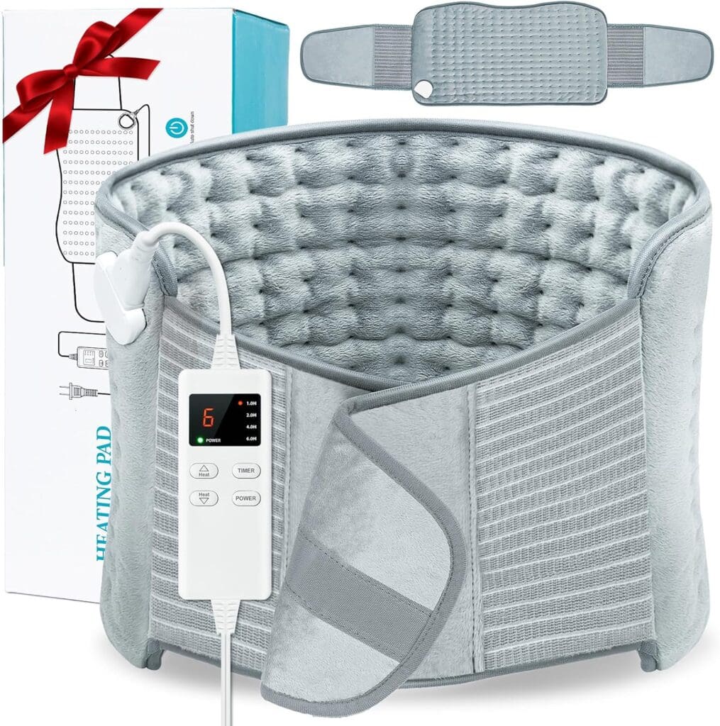 A gray heating pad with a digital controller is wrapped in a cylindrical shape, showing adjustable straps. The packaging box is visible behind it, featuring an image of the pad and a decorative red ribbon.