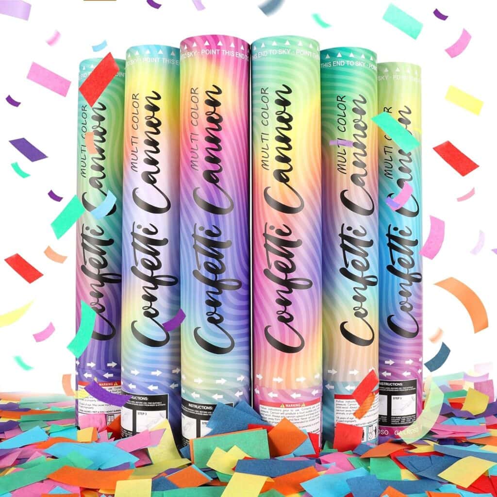 Five colorful confetti cannons stand upright amid scattered confetti, with pieces of multicolored confetti falling through the air against a white background.