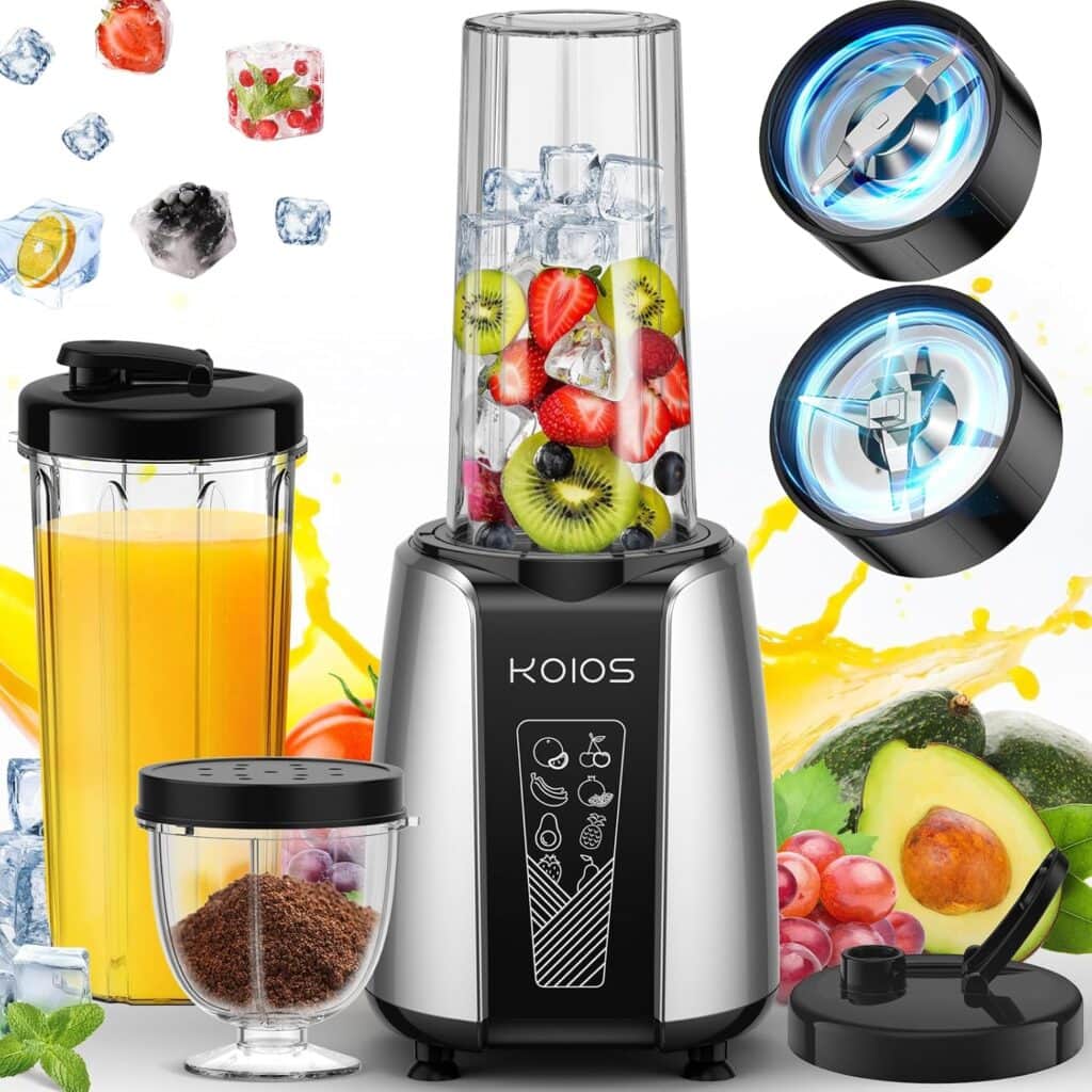 A KOIOS blender with a tall blending cup filled with ice and fruits, extra cups and lids, two blade attachments, ground coffee, and various fruits and juice splash in the background.