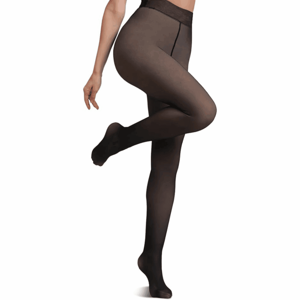 A person wearing sheer black tights stands with one leg bent and toes pointed, arms relaxed at their side, against a plain white background—perfect for showcasing fleece lined tights now available at 79% off.