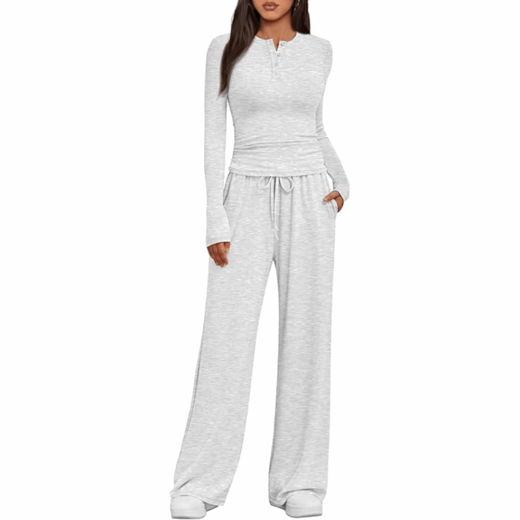 A woman models a light gray 2 piece matching set—long-sleeve buttoned henley top and drawstring wide-leg pants with pockets, paired with white sneakers, against a white background. Women's lounge set available now at 57% off.