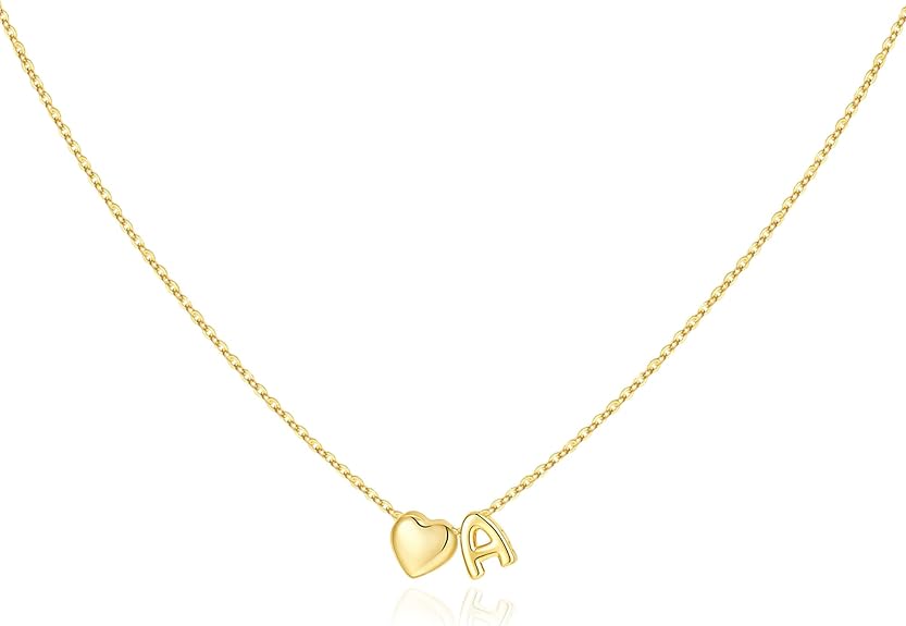 A delicate gold chain necklace featuring a small heart charm and the letter "A" charm side by side.