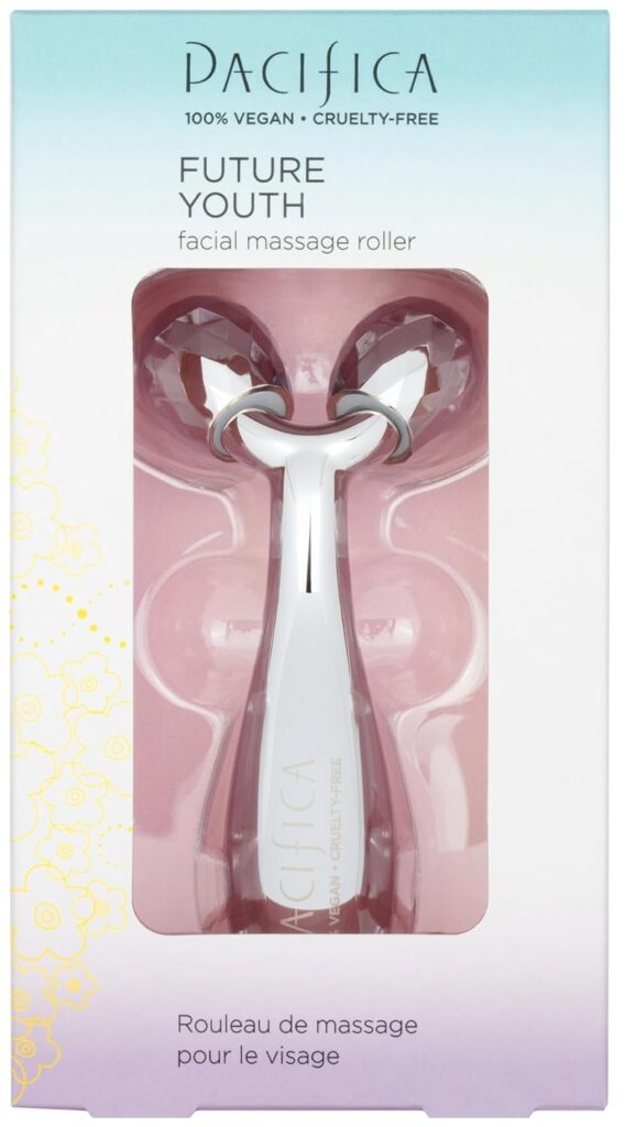 A Pacifica Future Youth facial massage roller in white and pink is displayed in its packaging, which highlights that the product is 100% vegan and cruelty-free. Text appears in English and French.