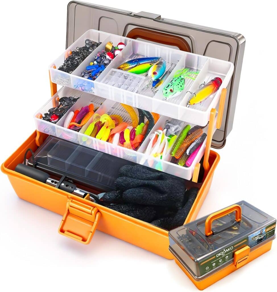 An orange tackle box with multiple compartments open, showing various colorful fishing lures, bait, hooks, and tools organized inside. A smaller, closed tackle box is placed in front.