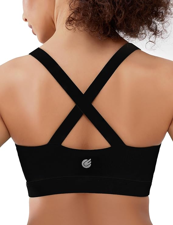 A woman with curly hair is shown from the back, wearing a high support women's sports bra with wide crisscross straps and a small logo in the center of the back band.