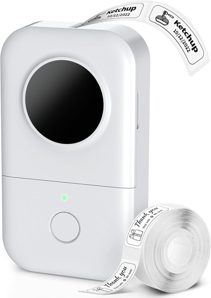 A compact white label printer is printing a label that says "Ketchup 10/24/2022" with a small bottle icon. A roll of "Thank You" labels is placed beside the printer.