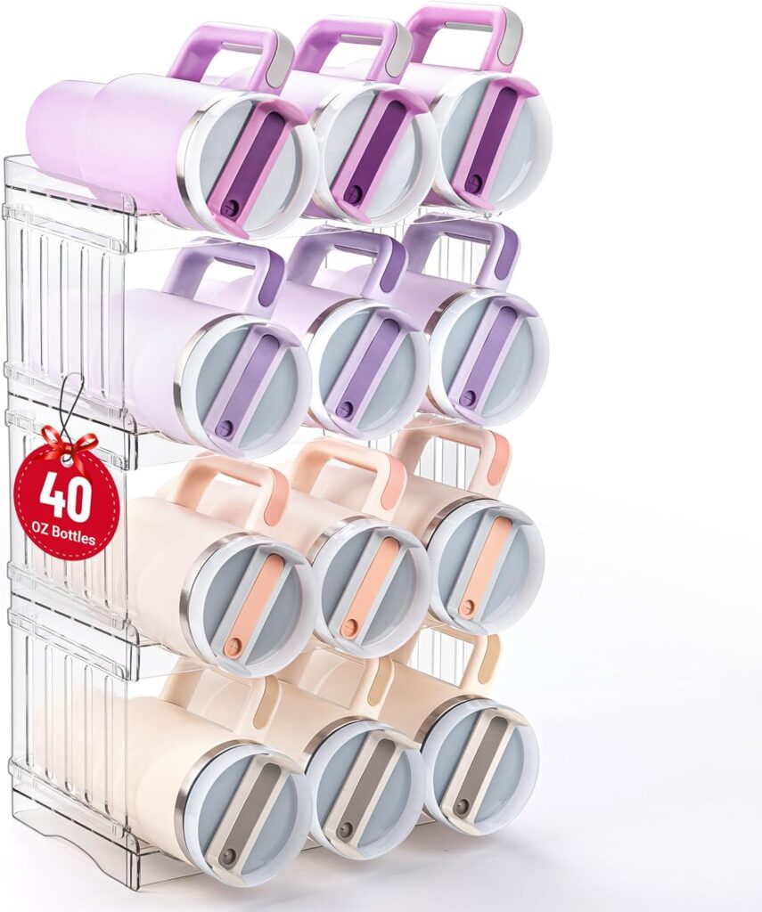 A clear storage rack holds twelve large insulated bottles in pastel colors—lavender, pink, peach, and cream—organized in three rows of four. A red tag on the rack reads "40 OZ Bottles.