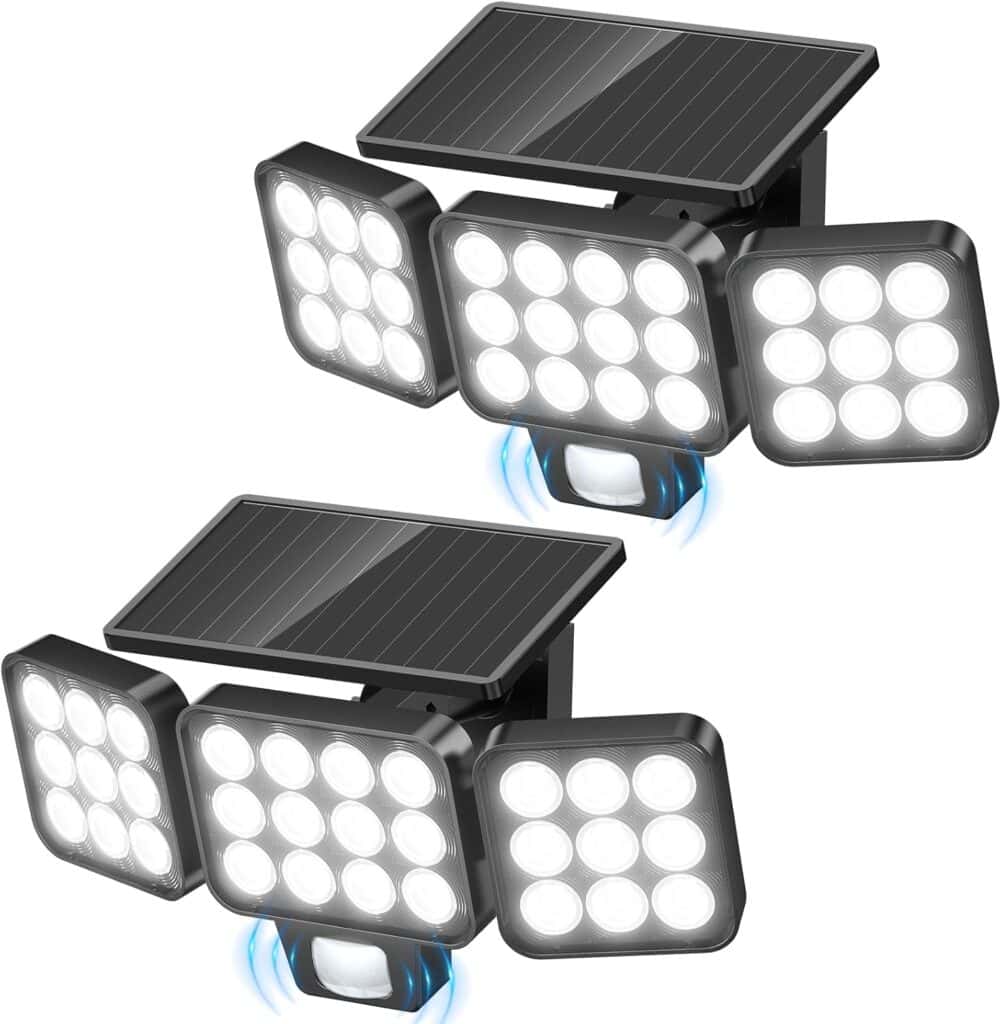 Two black outdoor solar-powered security lights with three adjustable LED panels each and a motion sensor beneath the center panel. Both lights feature rectangular solar panels on top.