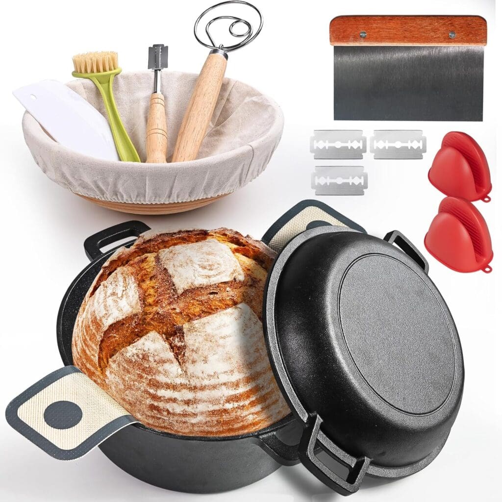 A sourdough bread baking set including a round loaf in a cast iron pot, proofing basket with liner, dough whisk, lame, scraper, basting brush, scoring blades, dough scraper, and two red silicone oven mitts.