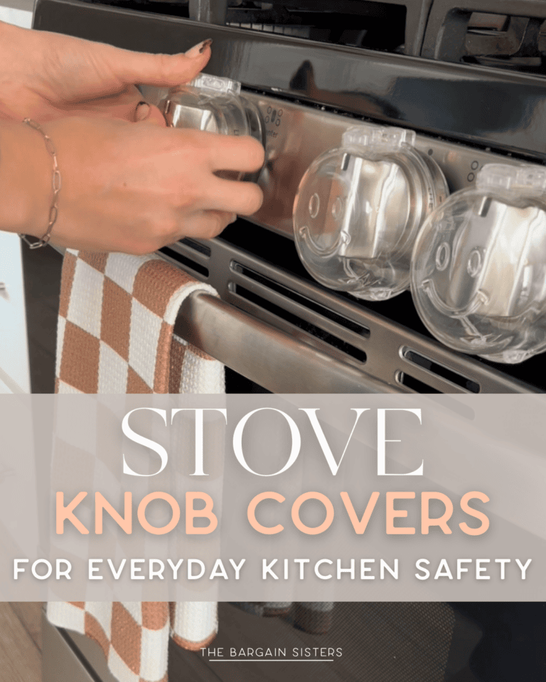 A person’s hands are placing stove knob covers on a black stove for safety. A checkered brown and white towel hangs from the oven handle. Text overlay reads: “Stove Knob Covers for Everyday Kitchen Safety.”.