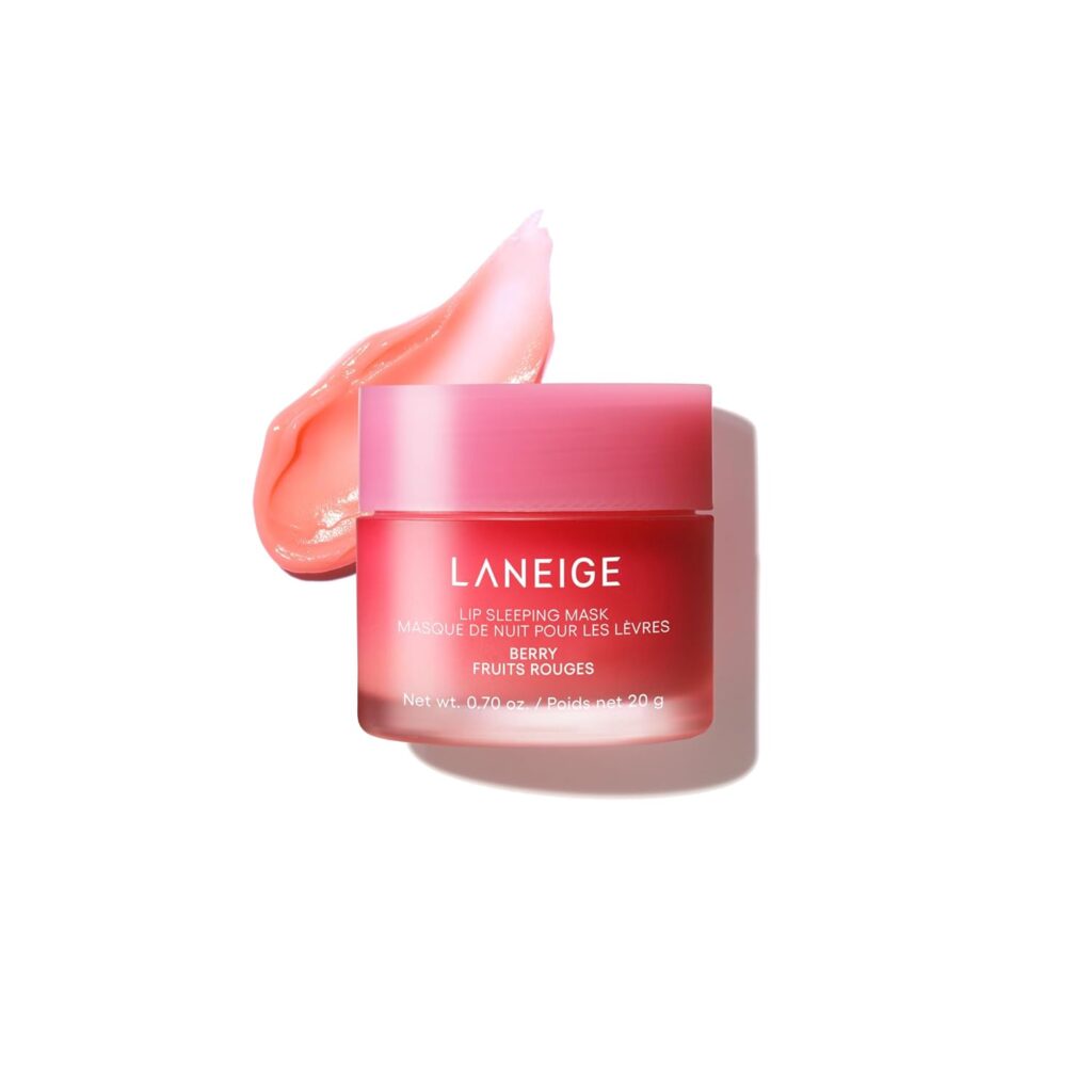A pink jar of Laneige Lip Sleeping Mask in Berry is shown with its lid off and a smear of the pink product next to it, all on a white background.