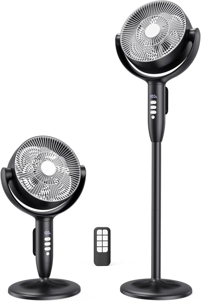 Two black oscillating pedestal fans, one short and one tall, stand side by side. Each has a circular base, control buttons on the stand, and a round grille. A small remote control is placed between them.