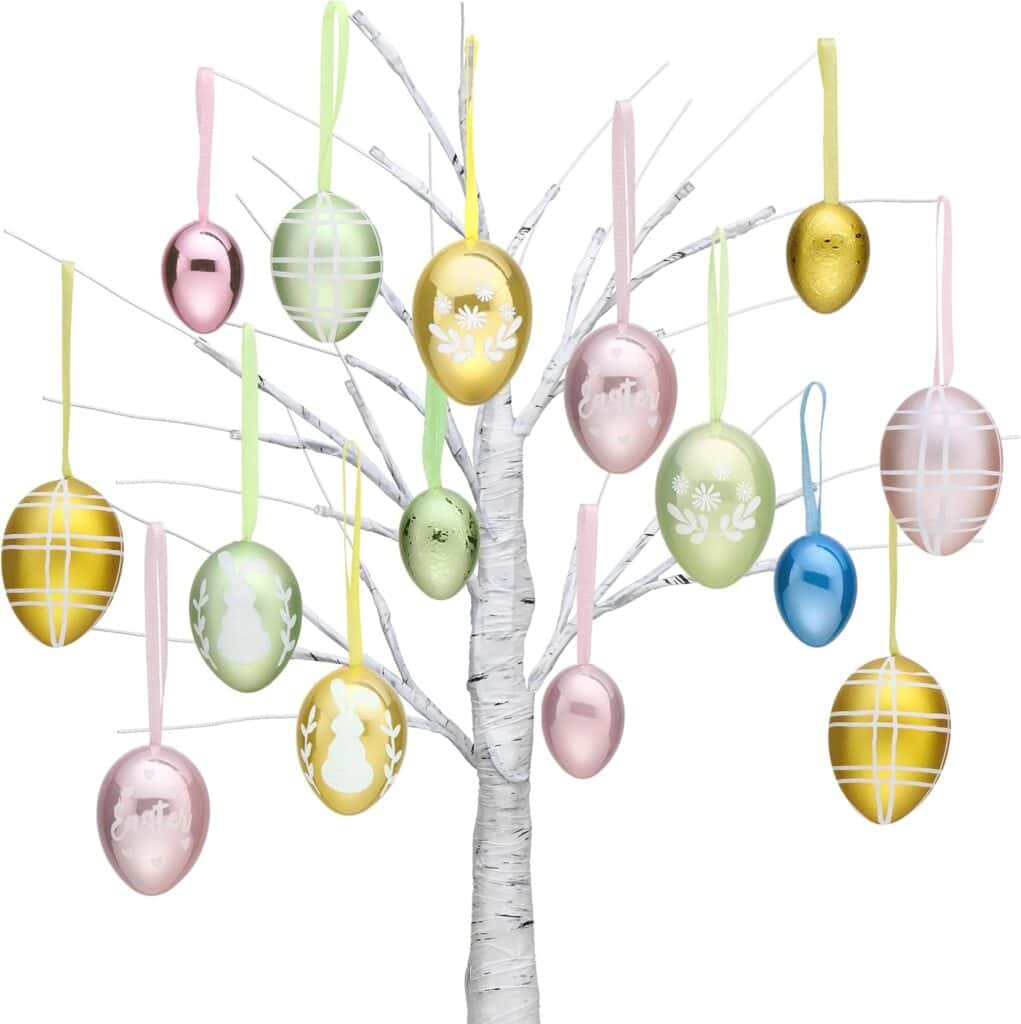 A white artificial tree decorated with pastel-colored Easter egg ornaments, including pink, green, yellow, and blue eggs, many featuring patterns, stripes, and festive designs, each hanging from a ribbon.
